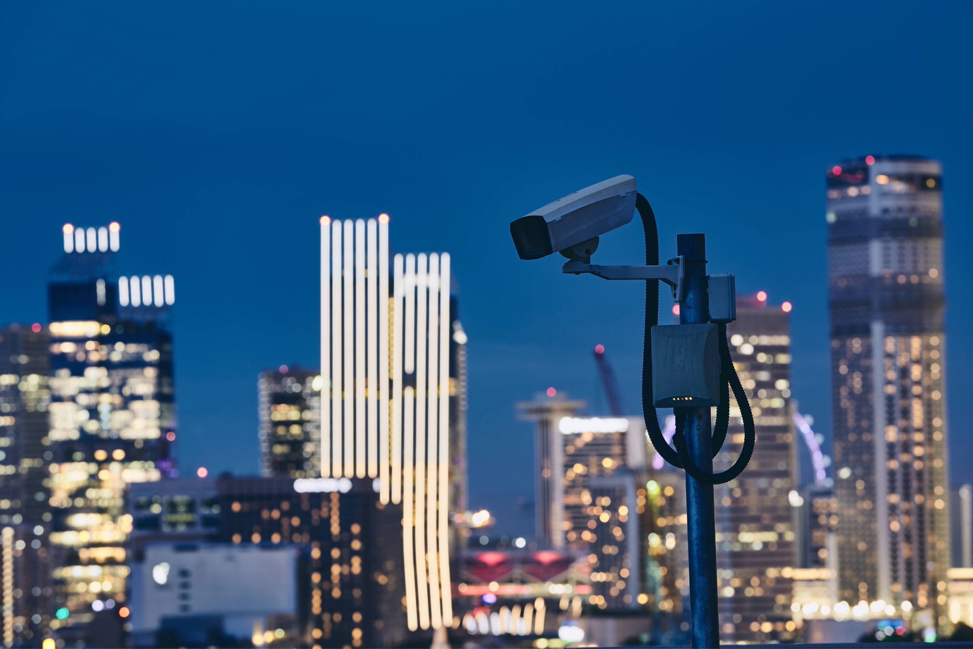 security-camera-against-illuminated-urban-skyline-2025-02-16-11-01-50-utc security-camera-against-illuminated-urban-skyline-2025-02-16-11-01-50-utc
